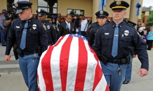 Hattiesburg police officers carry the coffin of their fallen colleague, Liquori Tate. PHOTO COURTESY : The Guardian