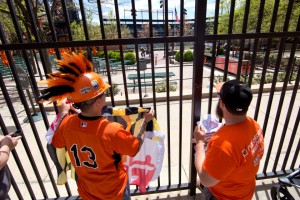 Fans Romeo Santos, left, and Matt Fouse gather ahead of a Baltimore Orioles baseball game against the Chicago White Sox's, Wednesday, April 29, 2015, outside Oriole Park at CamdenYards in Baltimore. The game was played in an empty Oriole Park at Camden Yards amid unrest in Baltimore over the death of Freddie Gray at the hands of police. (AP Photo/Matt Rourke)